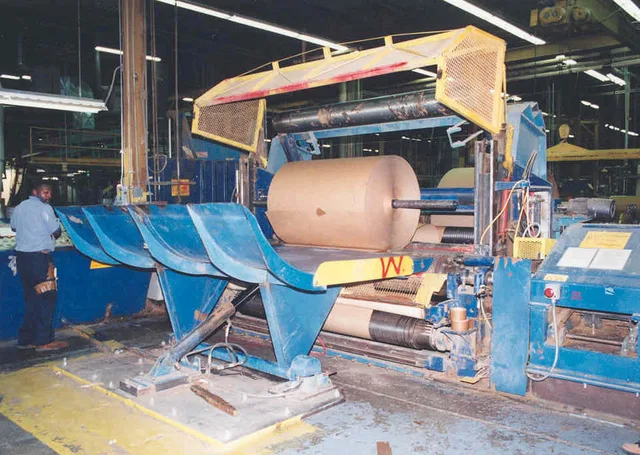Wide angle shot of large paper rolling / cutting machine. Chicago–Milwaukee paper imprint machinery: 8 checks before you buy